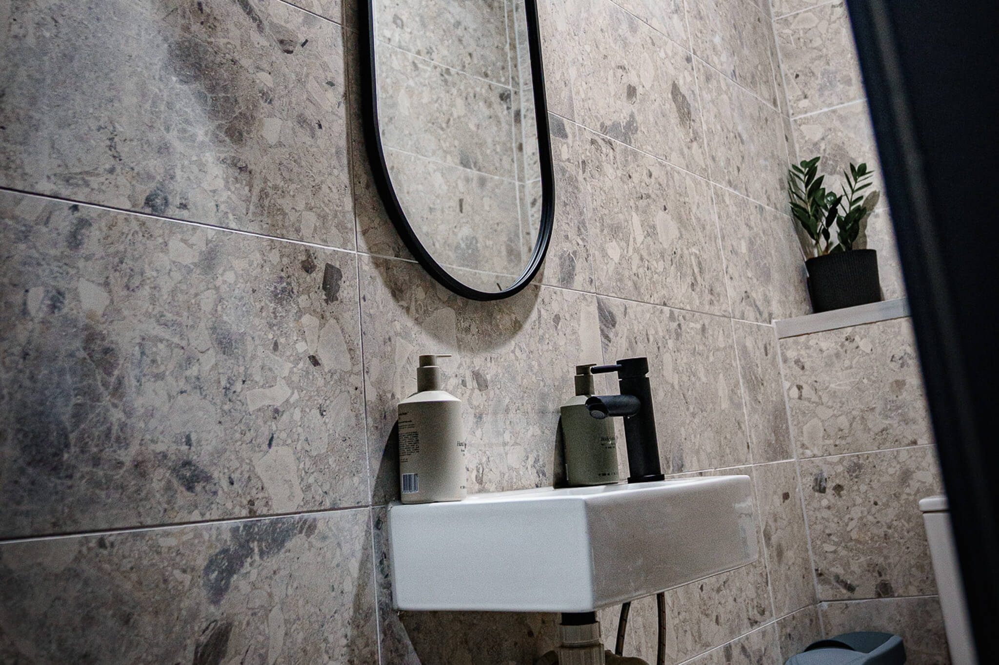 Modern bathroom basin with matte black tapware at Reps Fitness