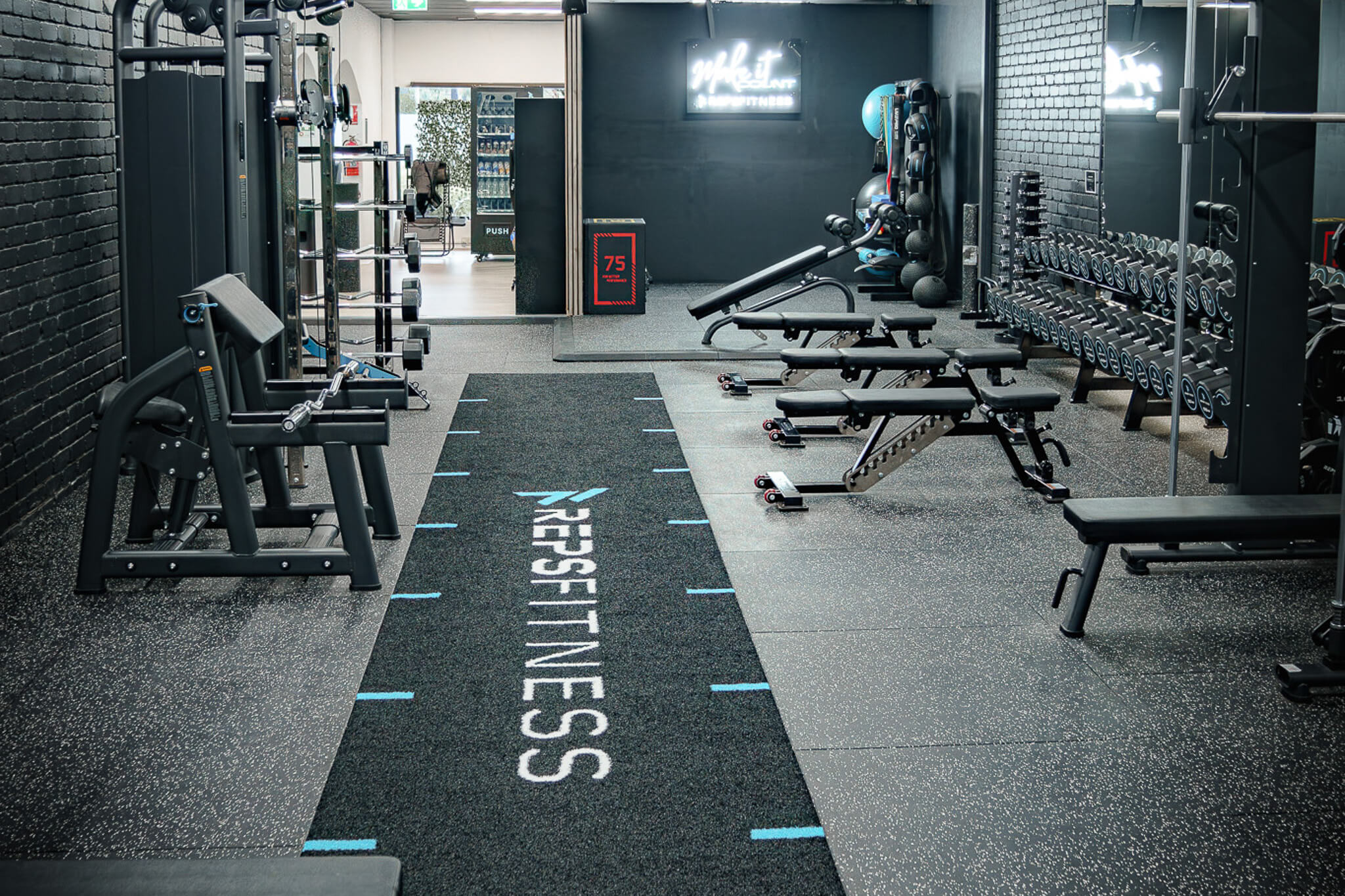Functional training turf lane with Reps Fitness branding at the Bayswater gym entrance