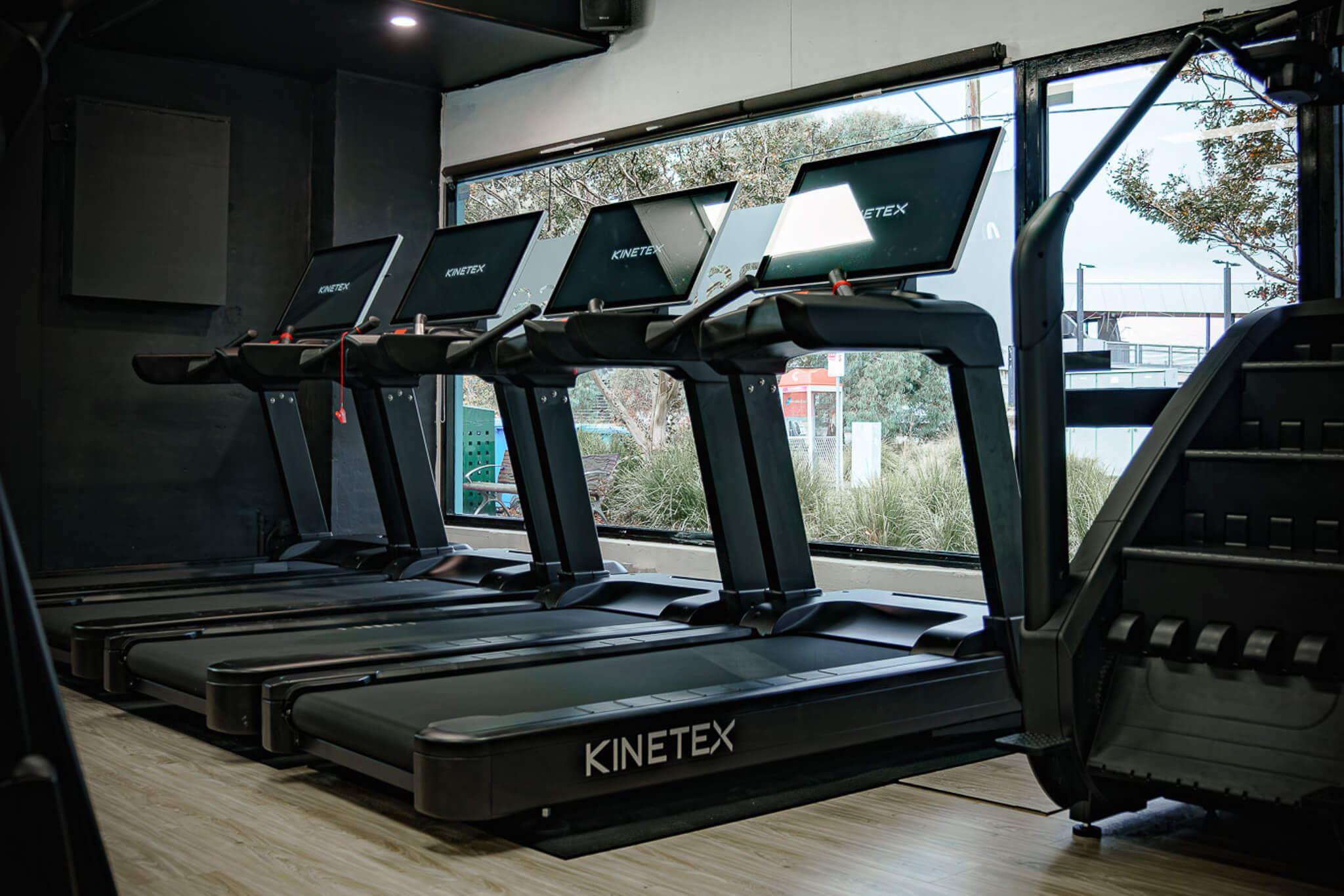 Cardio zone at Reps Fitness with Kinetex treadmills