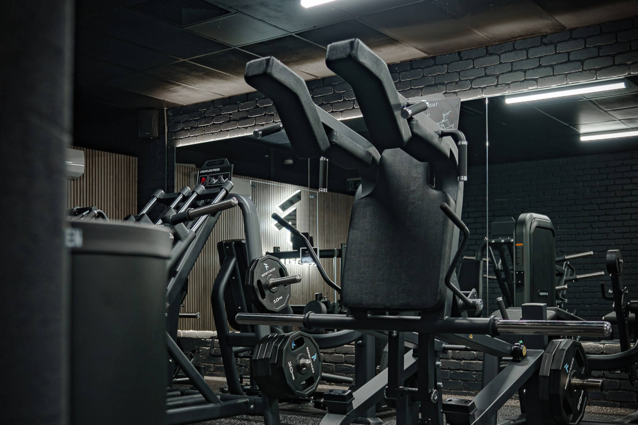 Plate-loaded resistance machine at Reps Fitness Bayswater