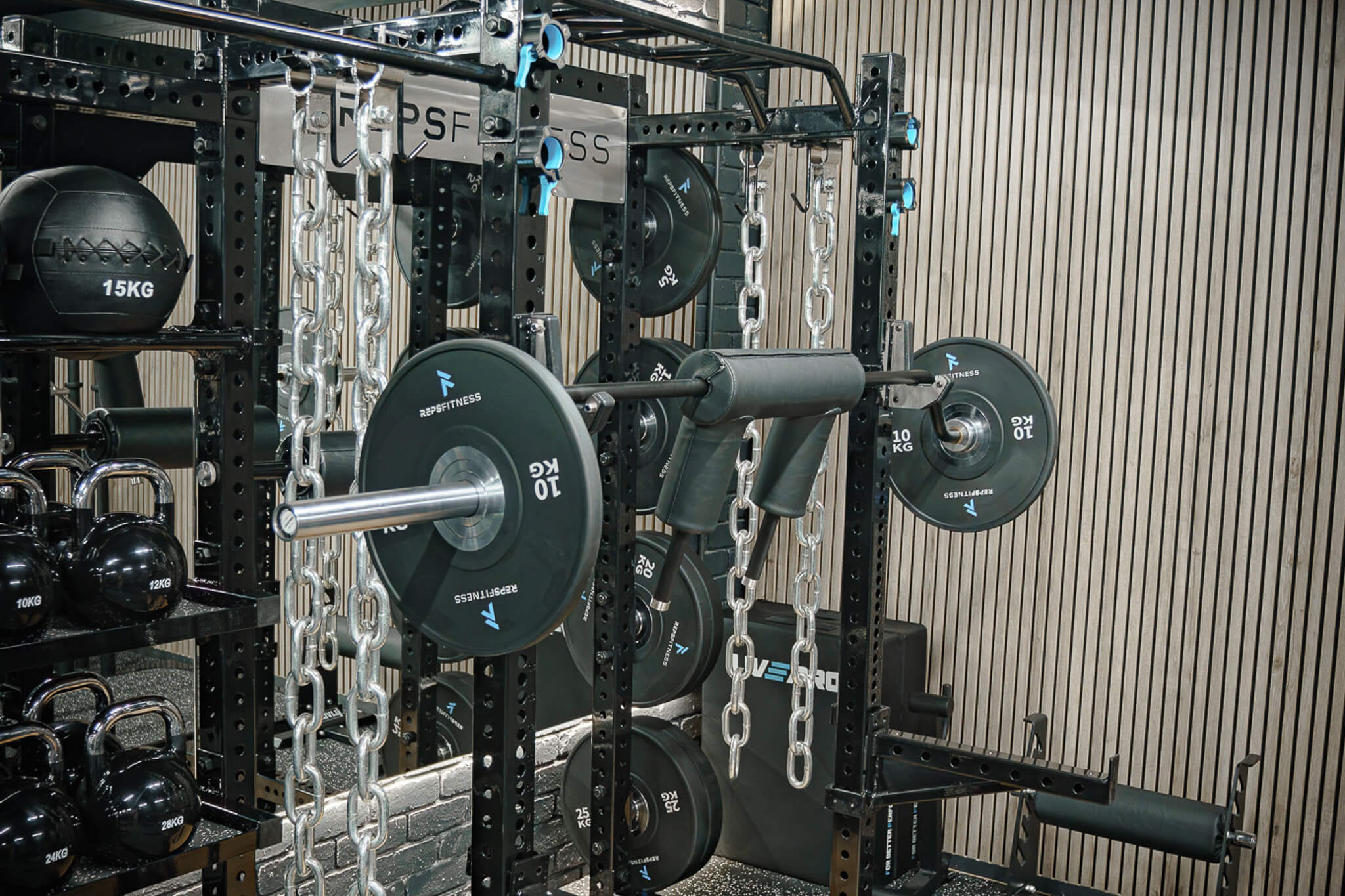 Strength zone at Reps Fitness with power rack and Olympic barbell
