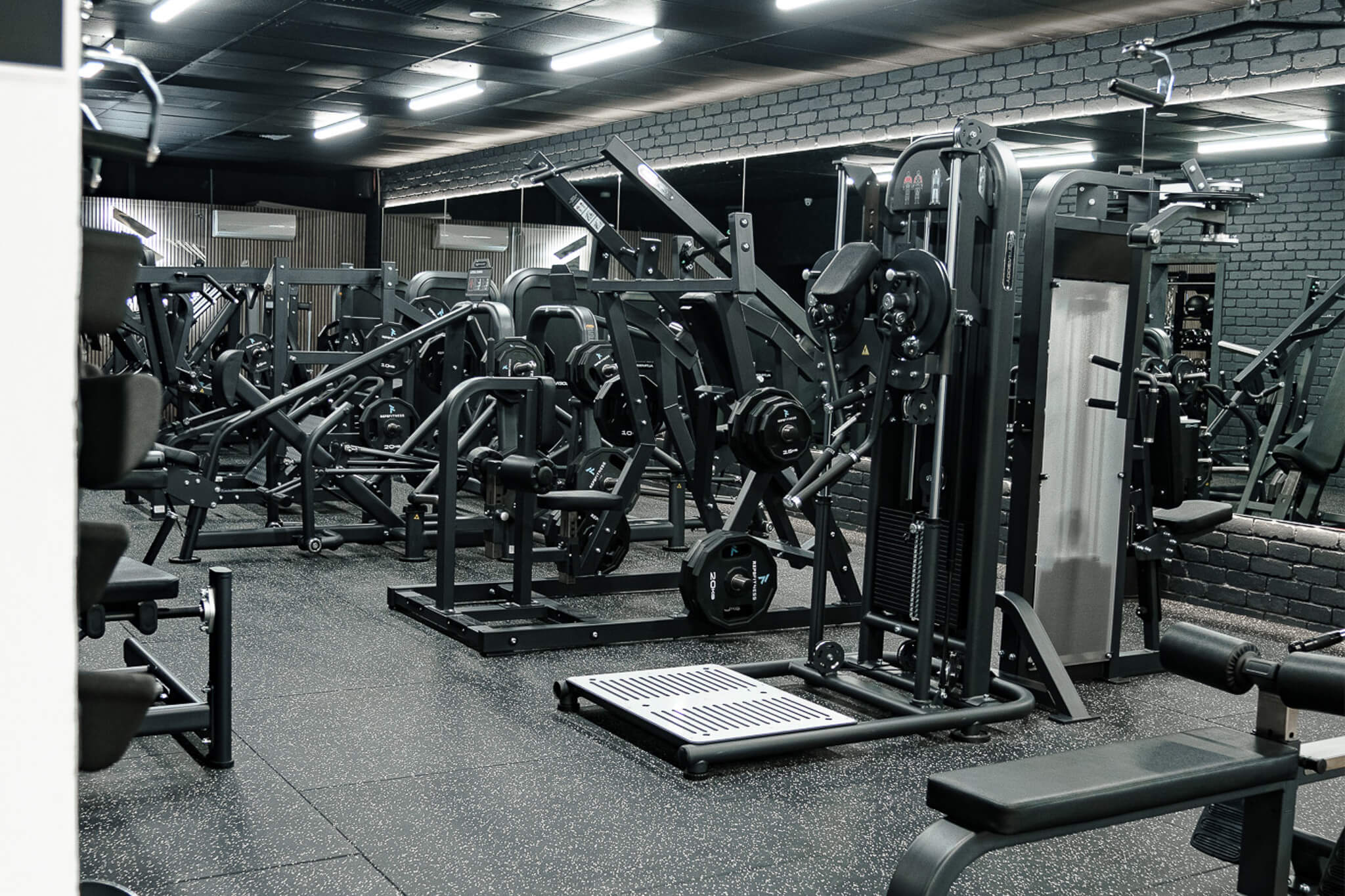Reps Fitness strength training floor with premium resistance machines and free weights